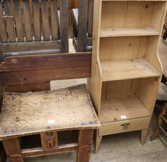 A pine waterfall bookcase and an African carved wood table W.46cm and 68cm